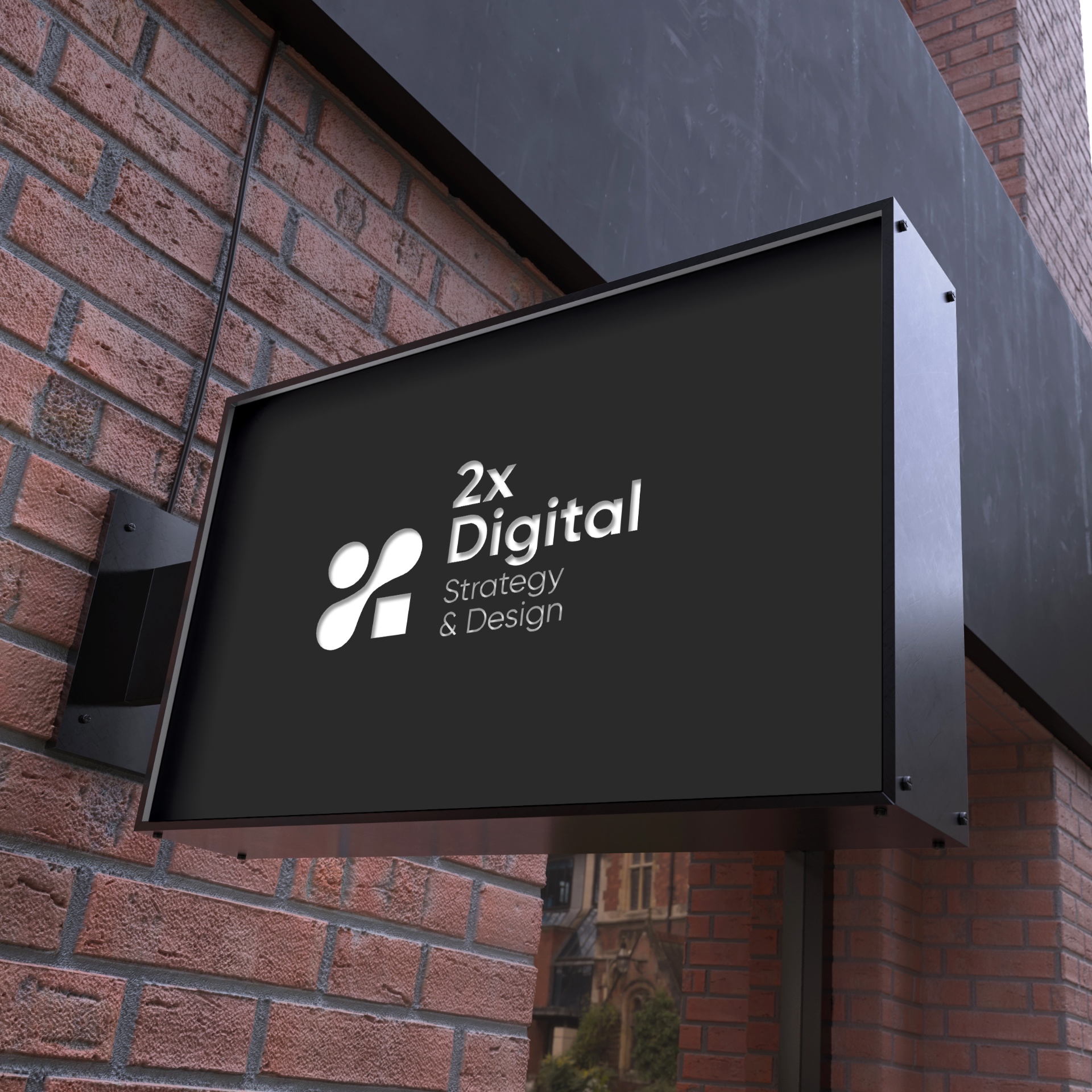 2X Digital exterior signage on black background showcasing Strategy & Design positioning