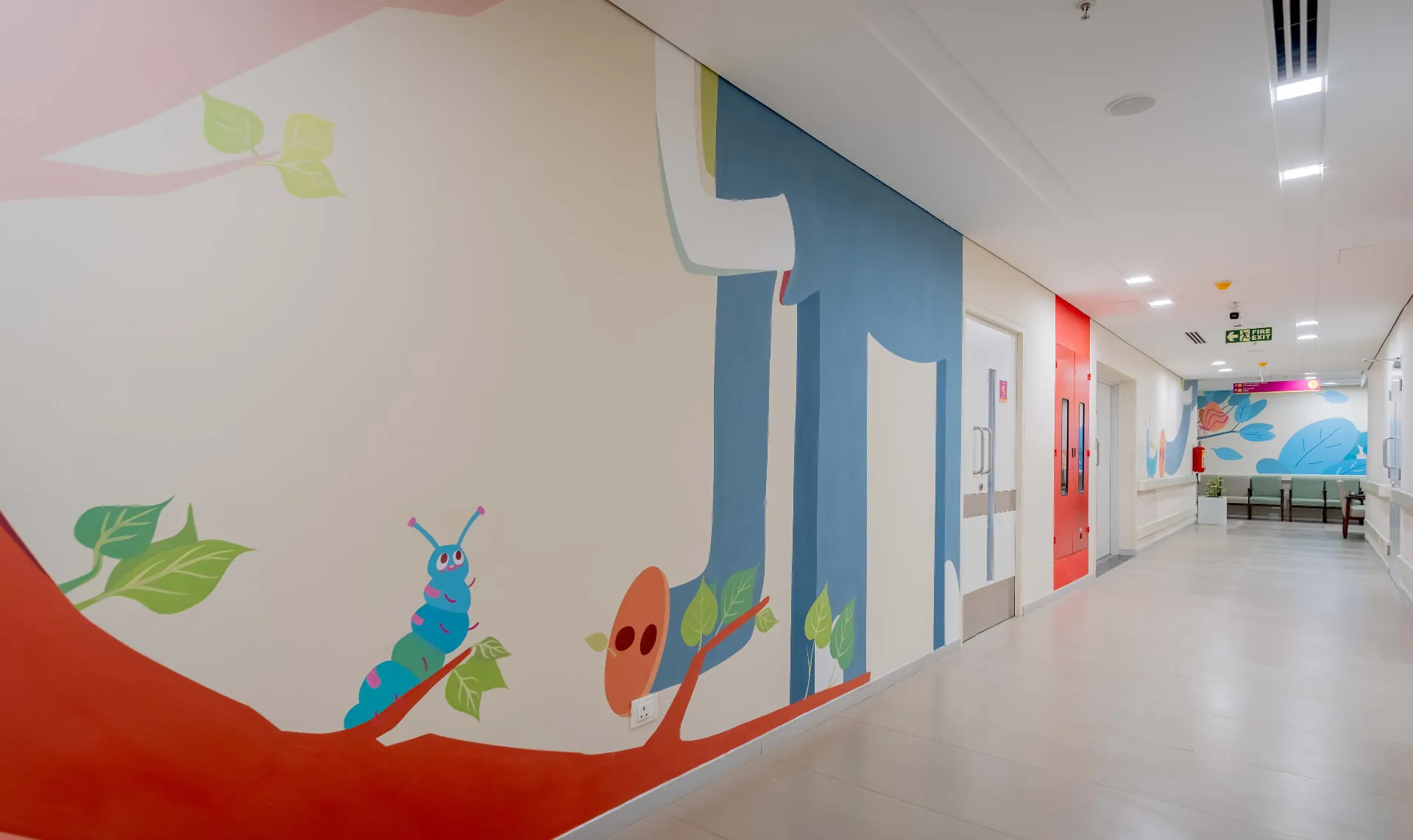 Kauvery Hospital - Corridor mural of the caterpillar resting on a branch