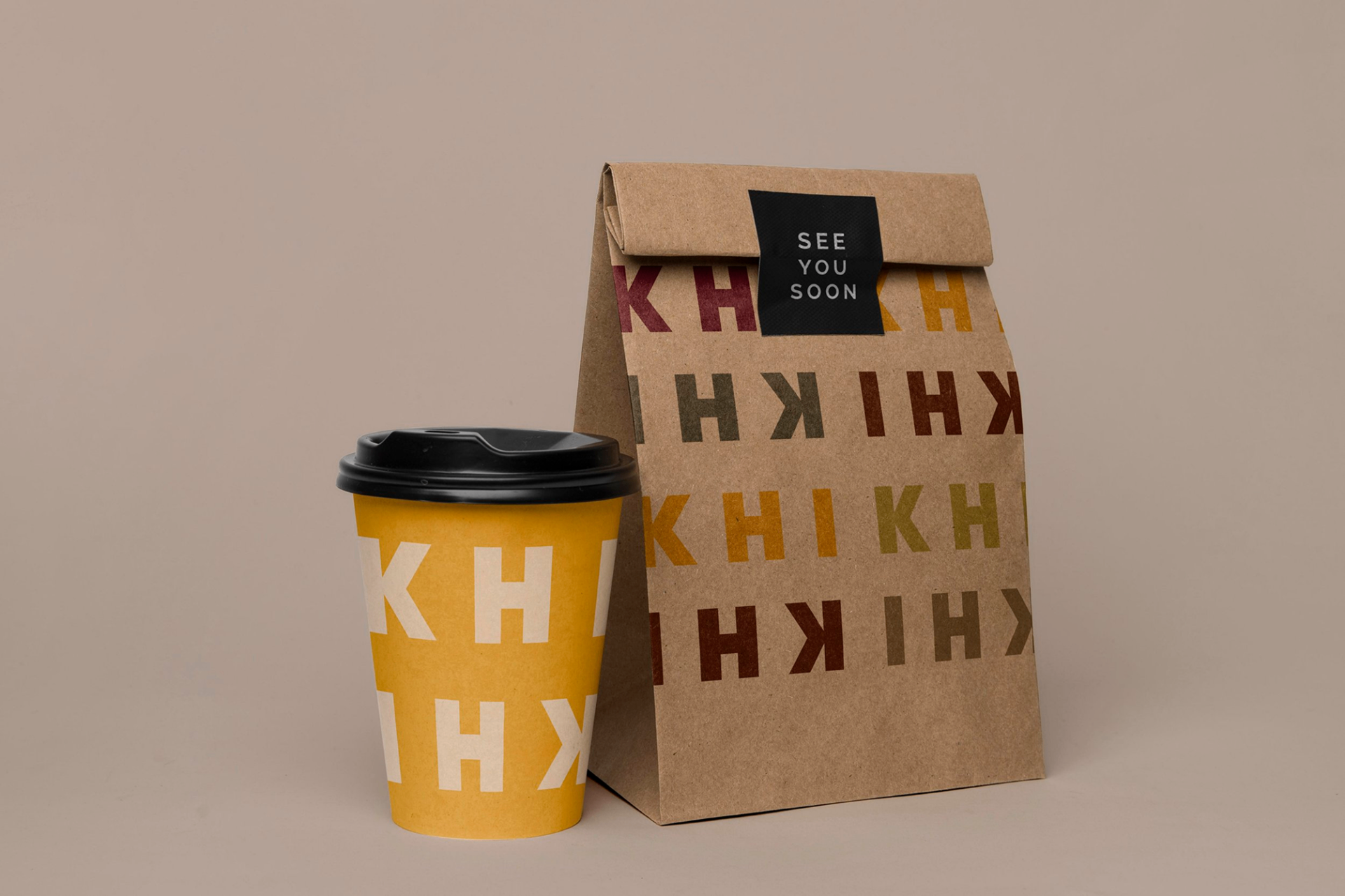 KHI KHI takeaway packaging with coffee cup and bag featuring colorful logo pattern and 'SEE YOU SOON' message